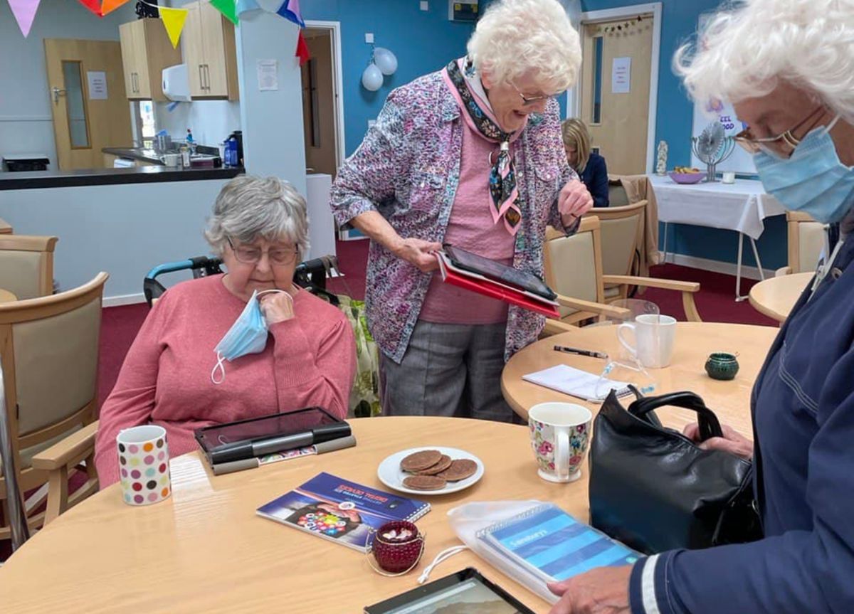 Learners with tablets at Age UK Doncaster