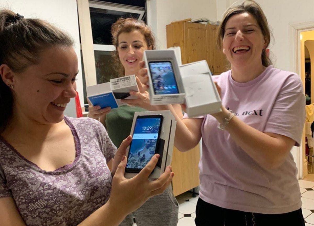 Volunteers setting up new tablets